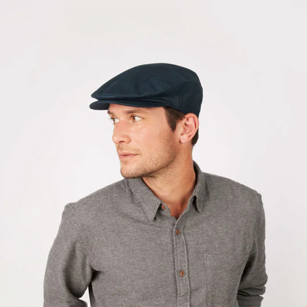 Man wearing IDH Linen Cap in lifestyle shot