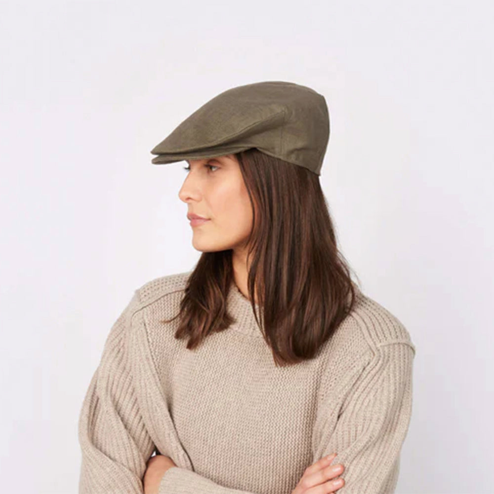 Woman wearing linen cap, lifestyle shot