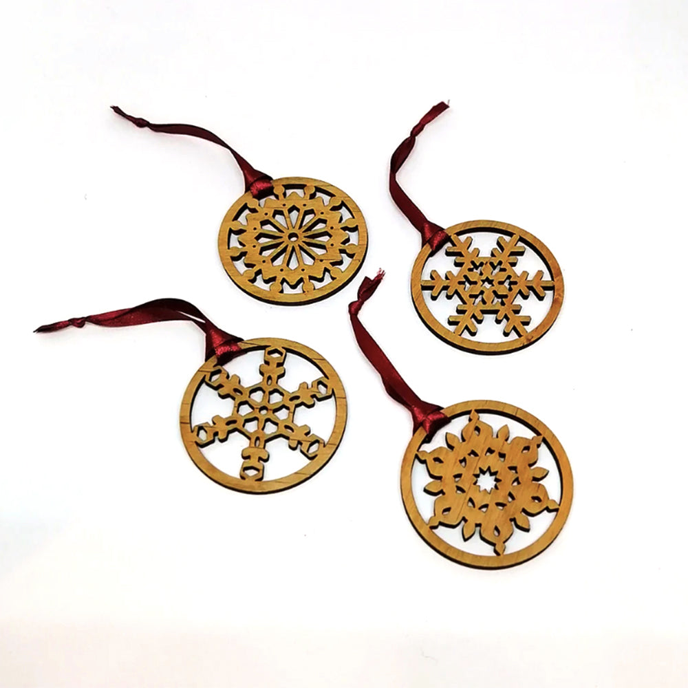 Wooden snowflake ornaments with red ribbon
