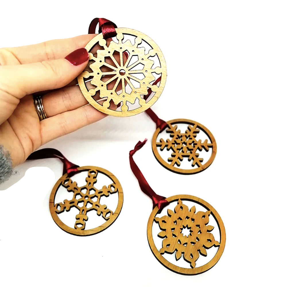 Wooden snowflake ornaments with red ribbon
