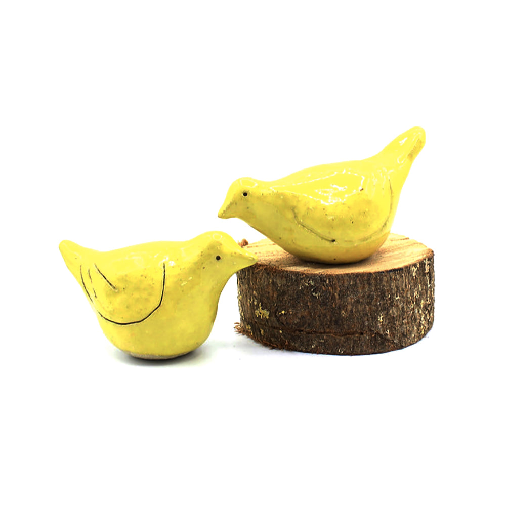 Yellow lovebird sculptures by Anita Reynolds