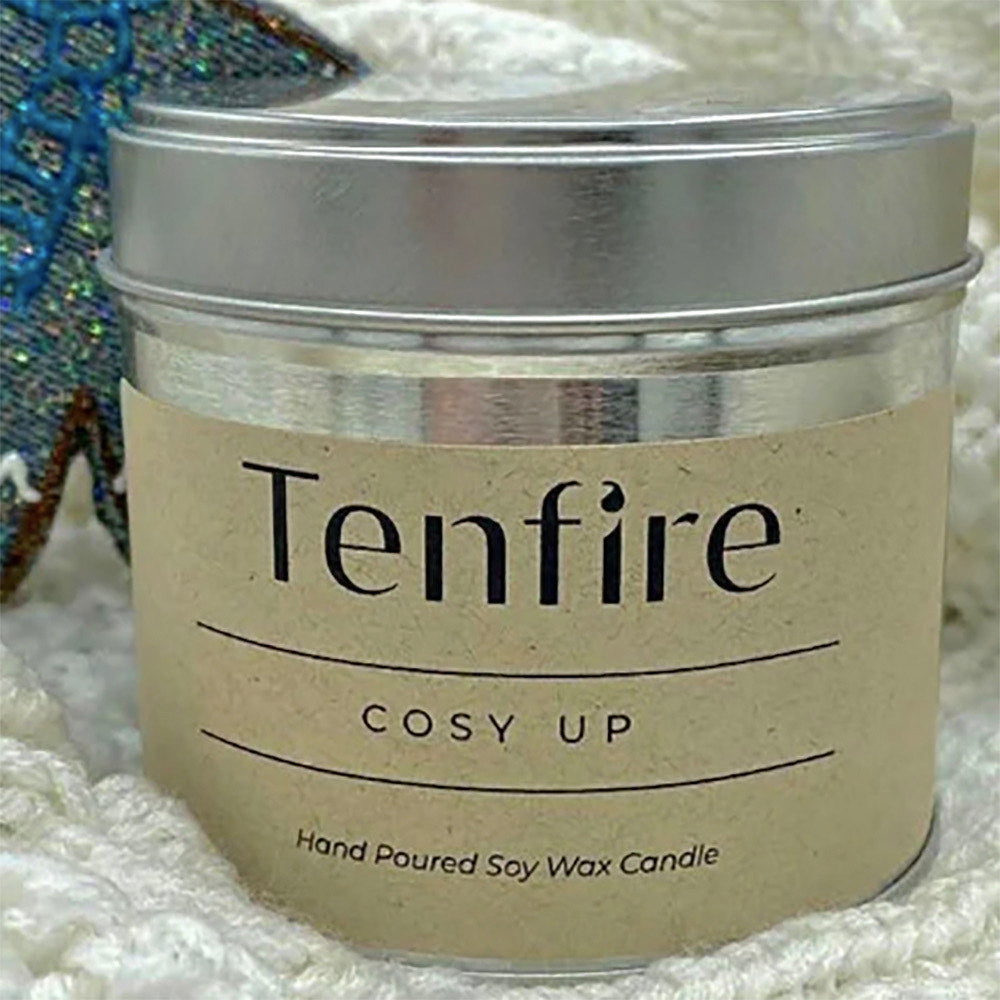 Candle in a silver tin with label Tenfire Cosy Up.