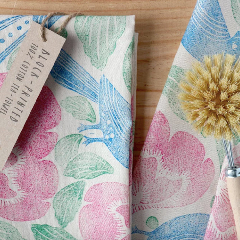 Fawn block-printed tea towel with floral and bird pattern