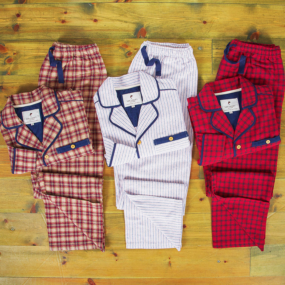 Plaid & striped pajama sets on wood