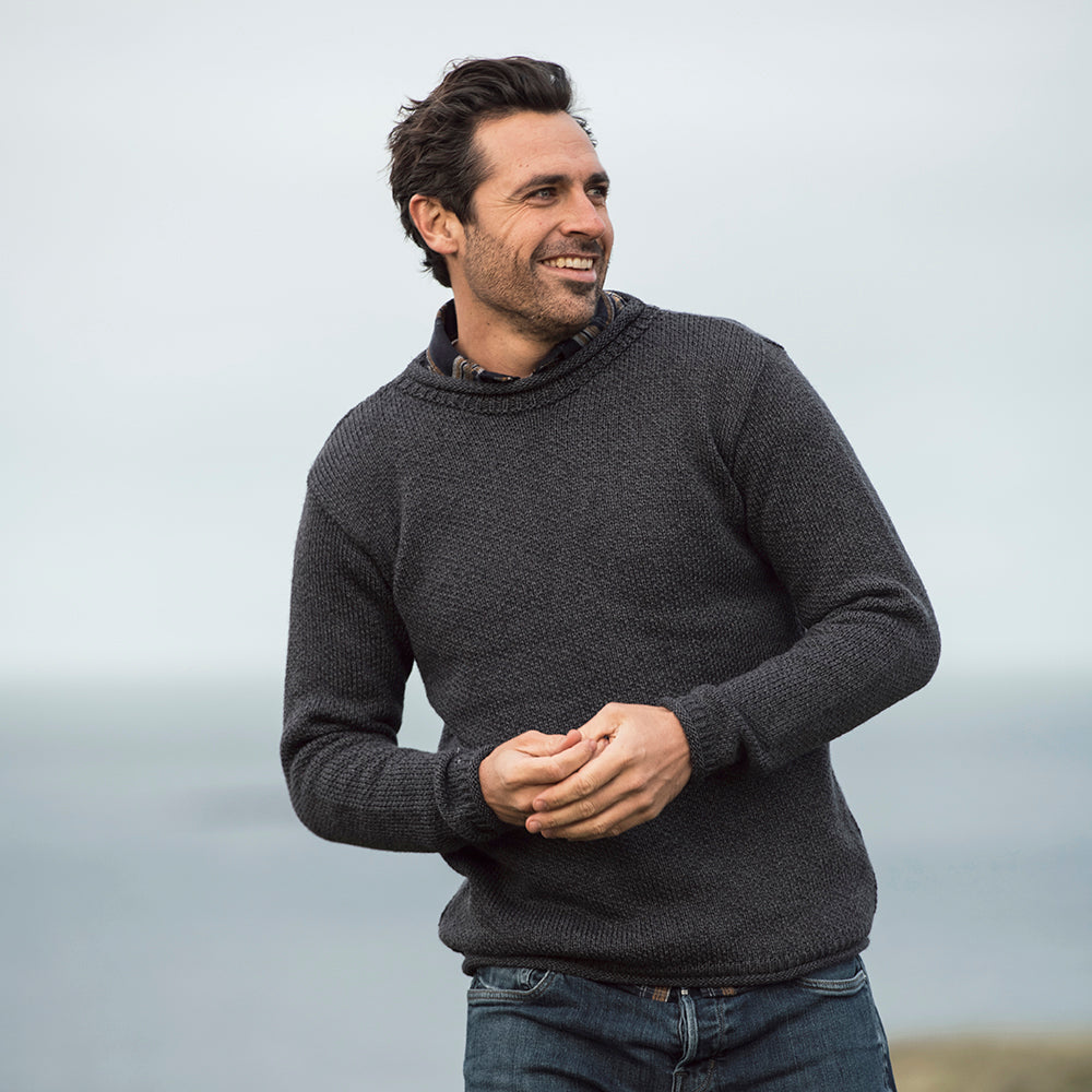 Man in gray roll neck sweater