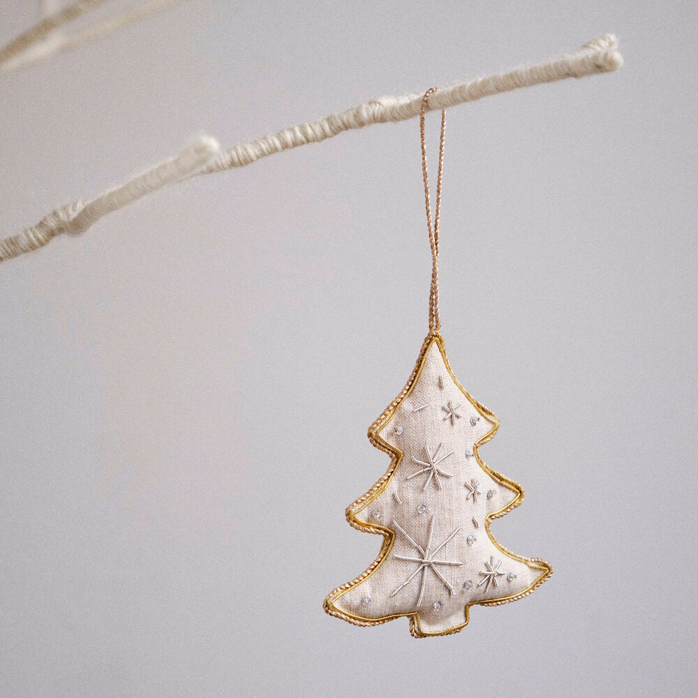 Square Christmas tree ornament hanging on branch