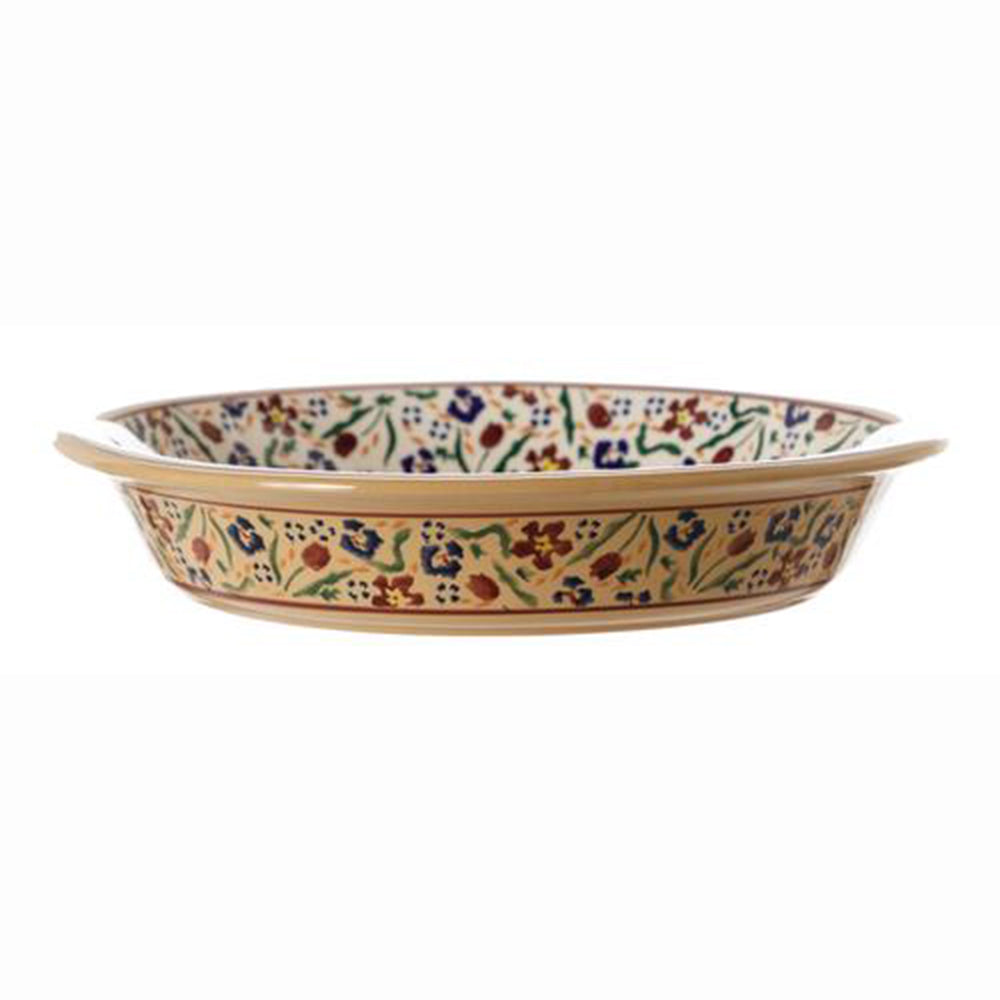 Classic pie dish with wildflower meadow design, side view.