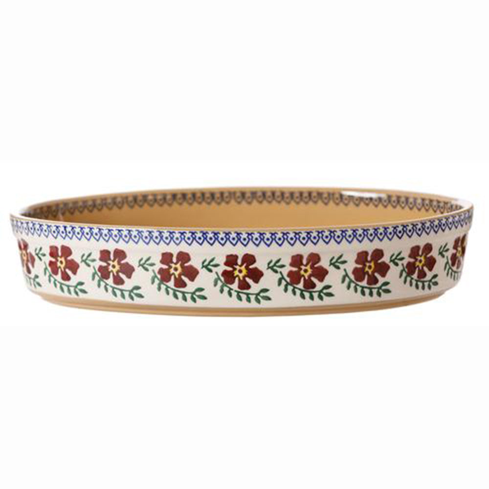 Oval oven-safe dish with Old Rose floral pattern, side view.