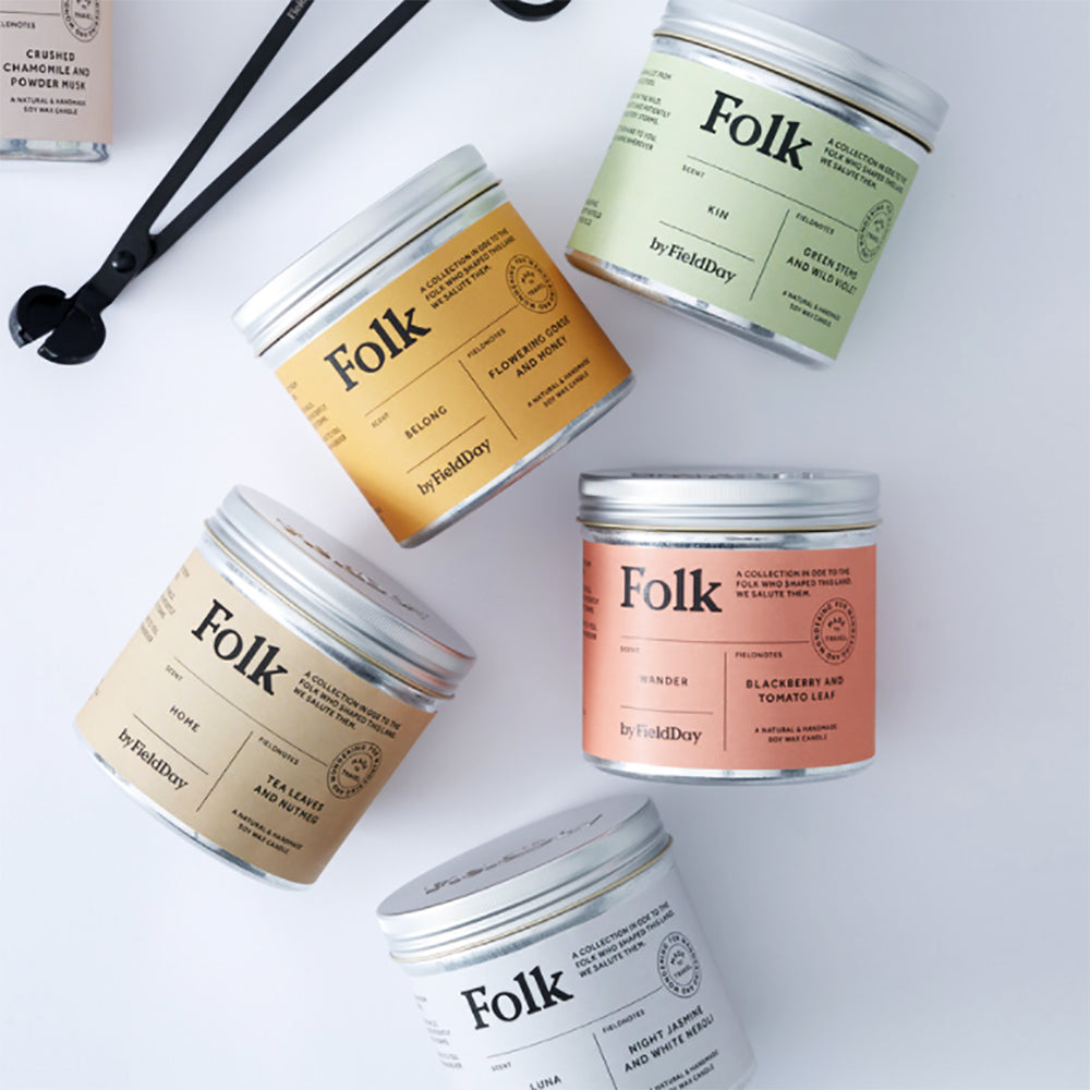 Tin candle covers with various scents by Folk