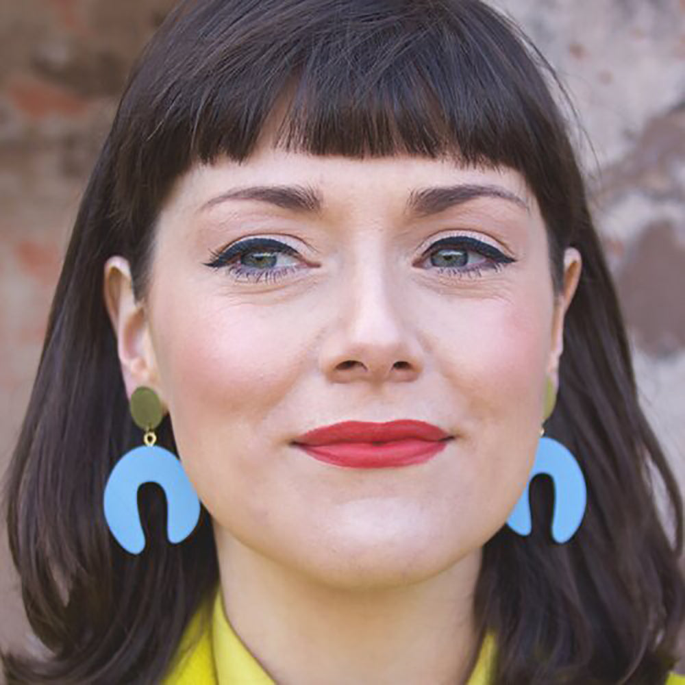 Woman with wedgewood blue earrings