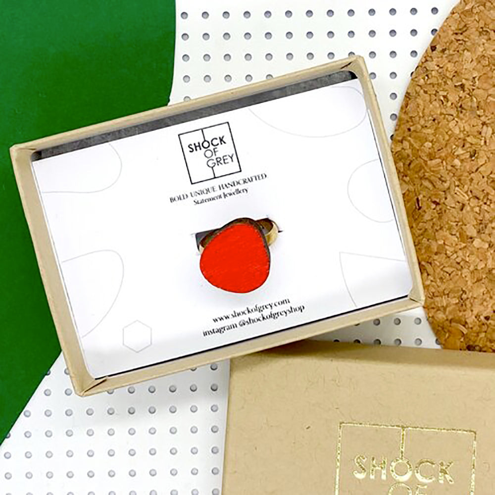 Red wooden egg ring in box