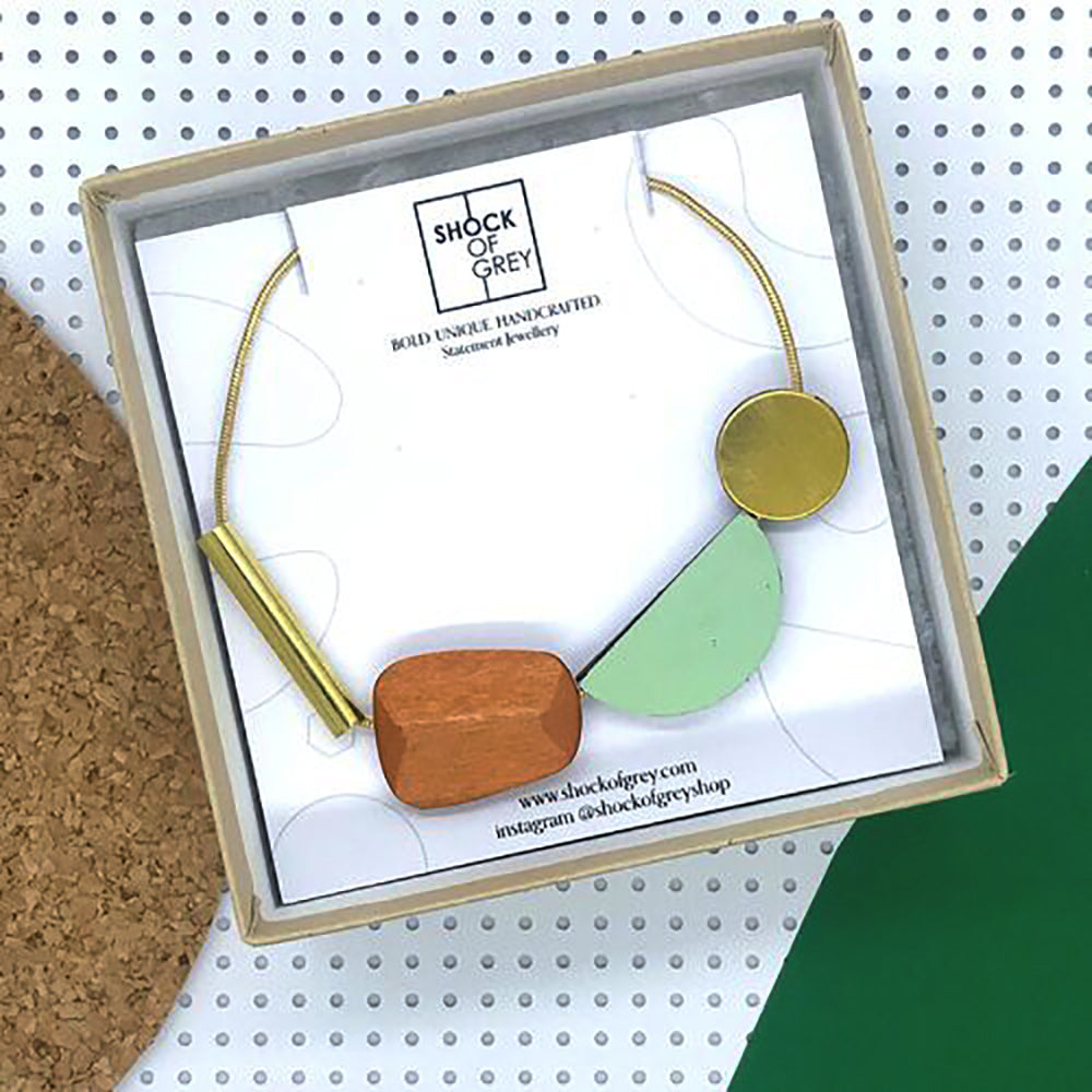 multi shape wooden necklace in colour sage green and wood.