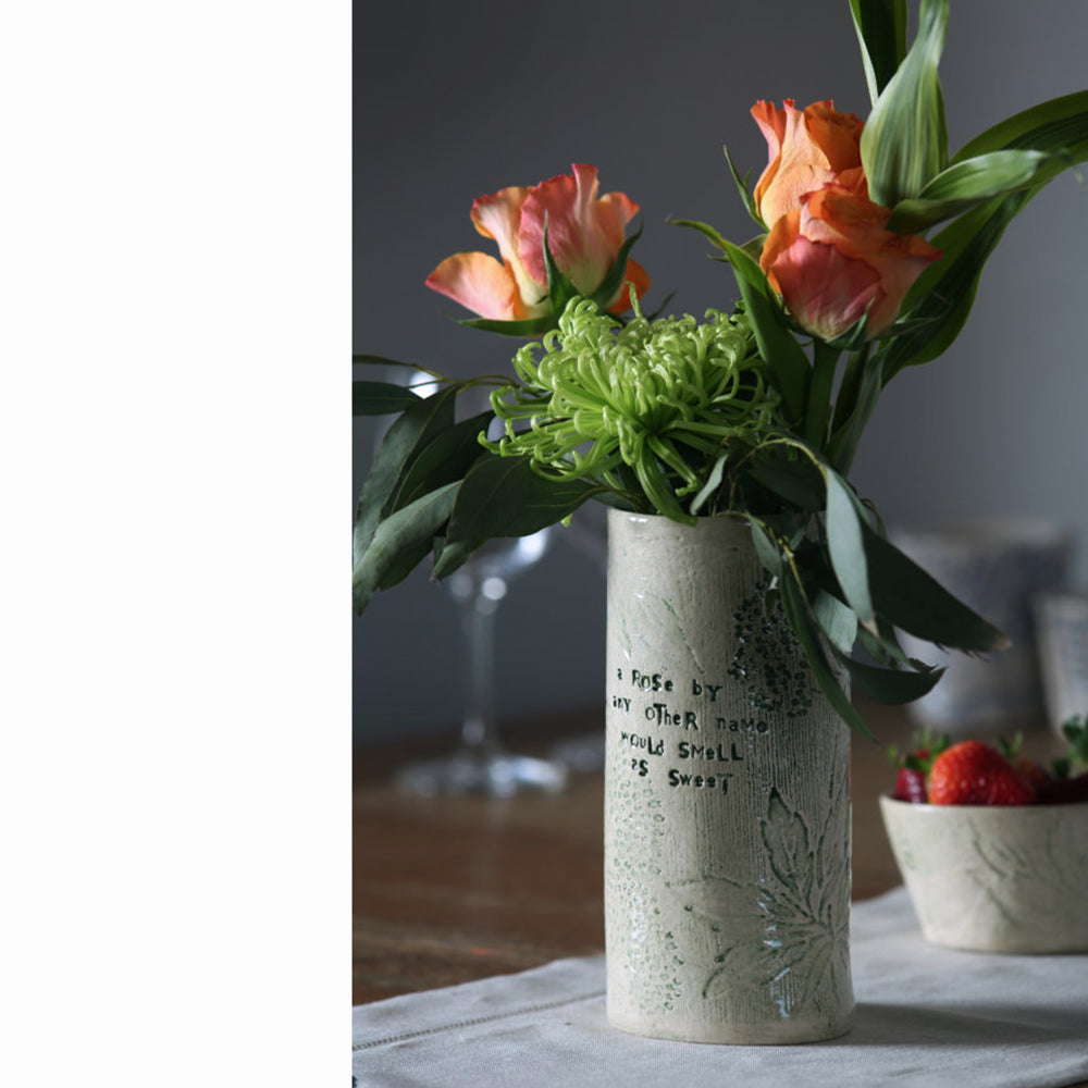 Square rose vase with orange roses