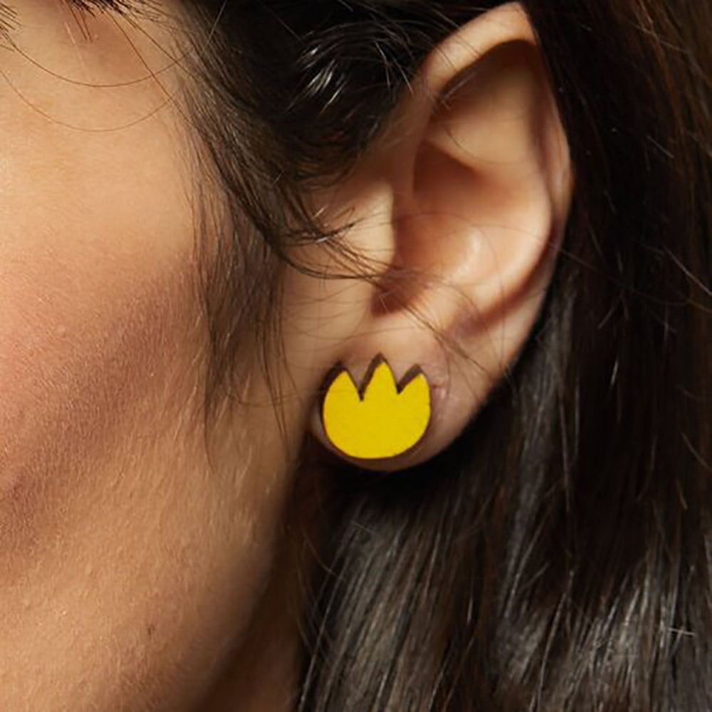 Yellow tulip stud earring on ear
