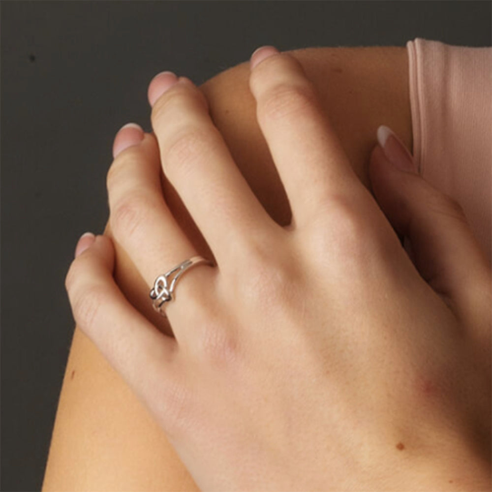 Triity ring on a woman's finger