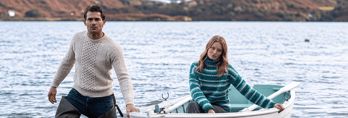 Couple in Fisherman Out Of Ireland Sweaters 