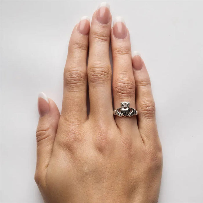 Lady wearing an Irish silver claddagh ring 