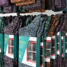 Display of Irish Cottage Socks with colorful patterns and visible brand packaging.