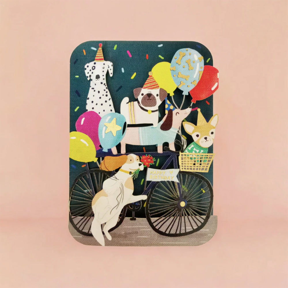 Birthday card with dogs on a bicycle and balloons