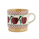 Ceramic mug with apple design and checkered pattern on a white background