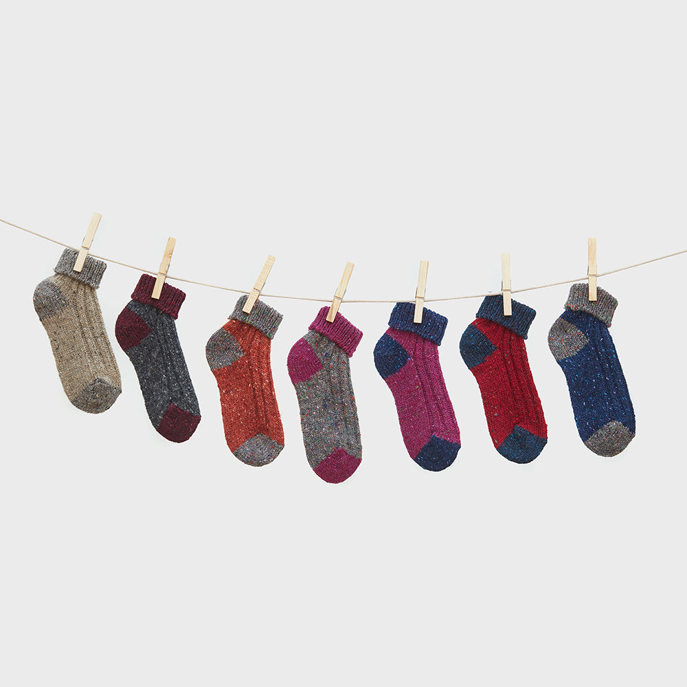 Aran Woollen Mills ankle socks hanging on a line