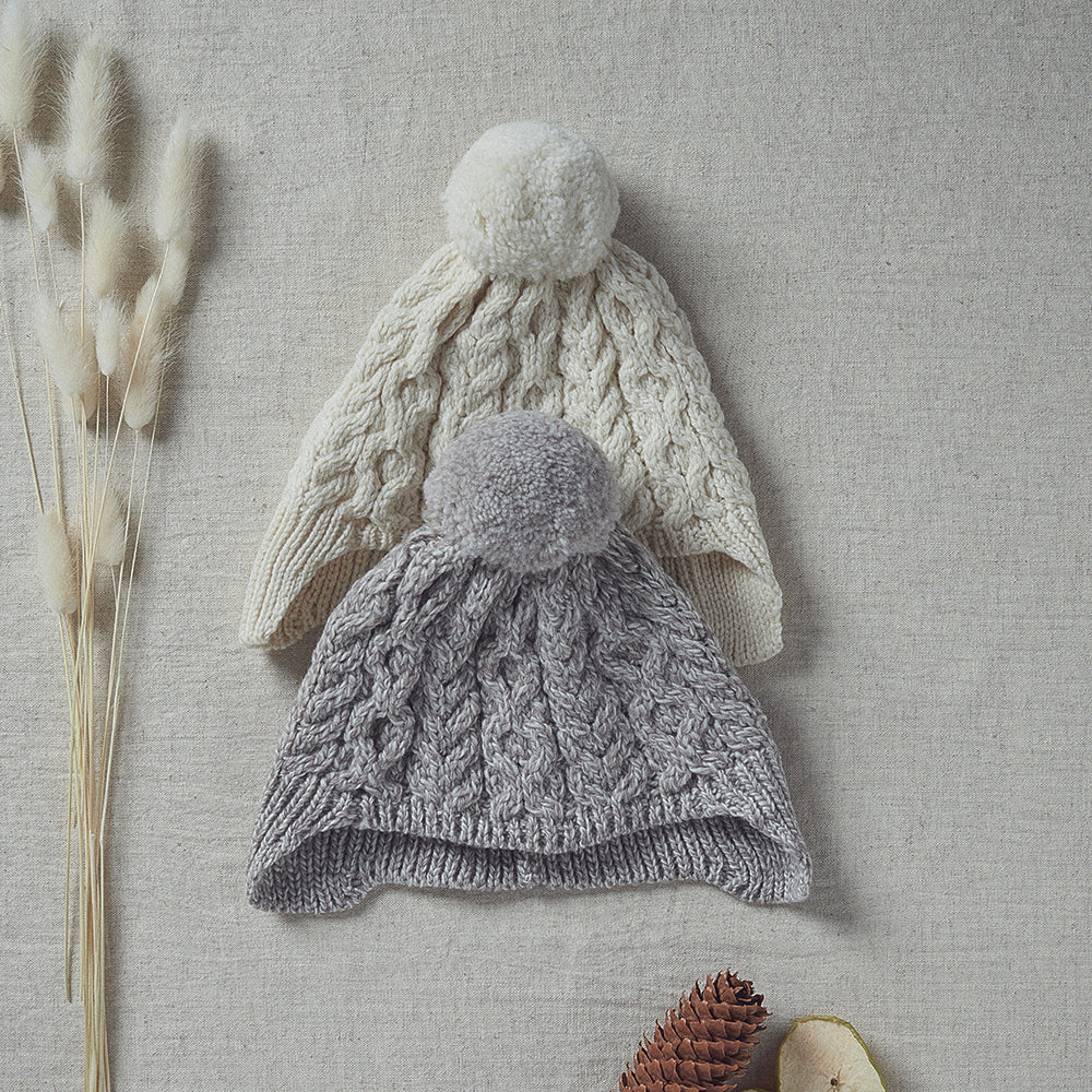 Kids Aran Woollen Mills ear flap caps in two colors