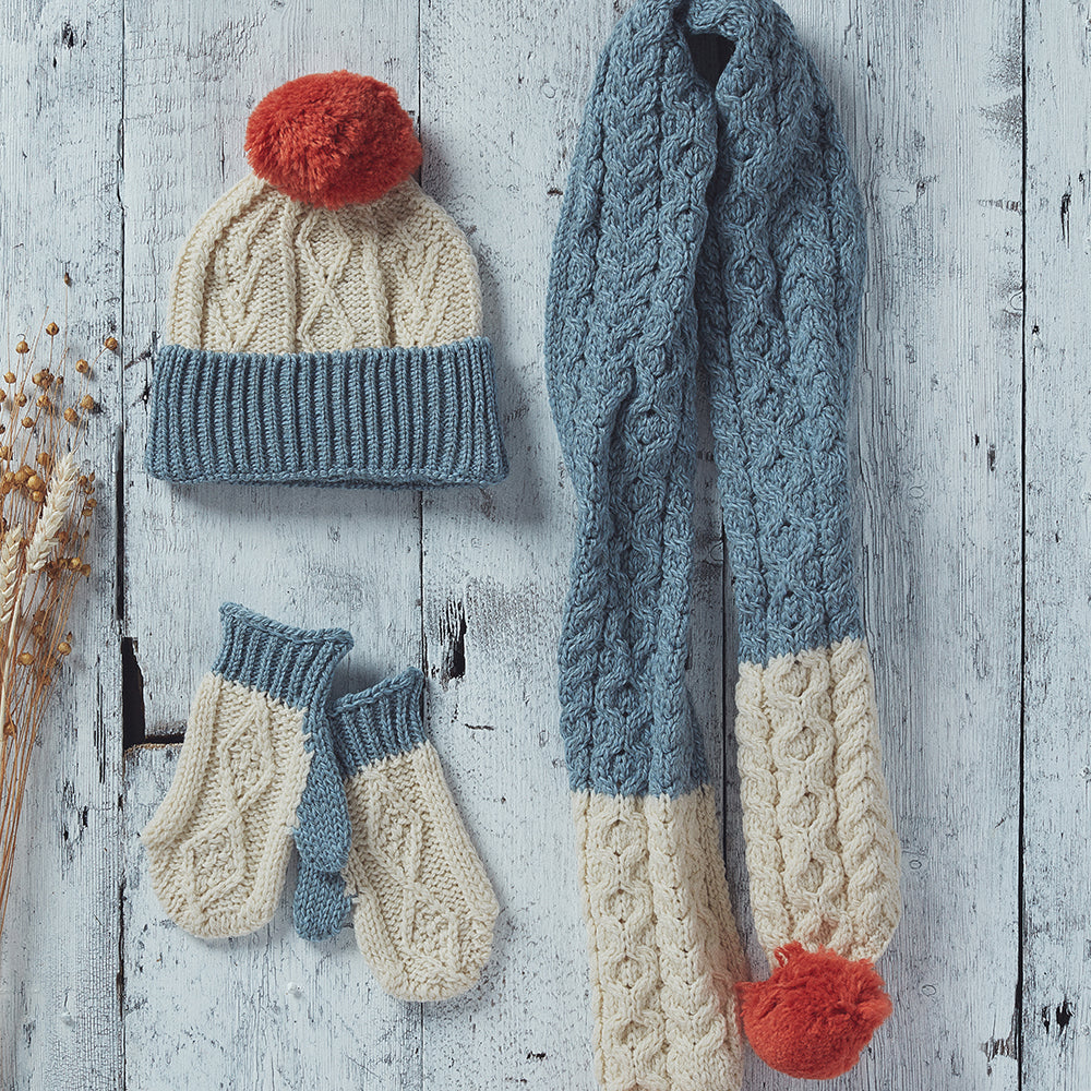 Kids cream and blue hat, scarf, and mitten set
