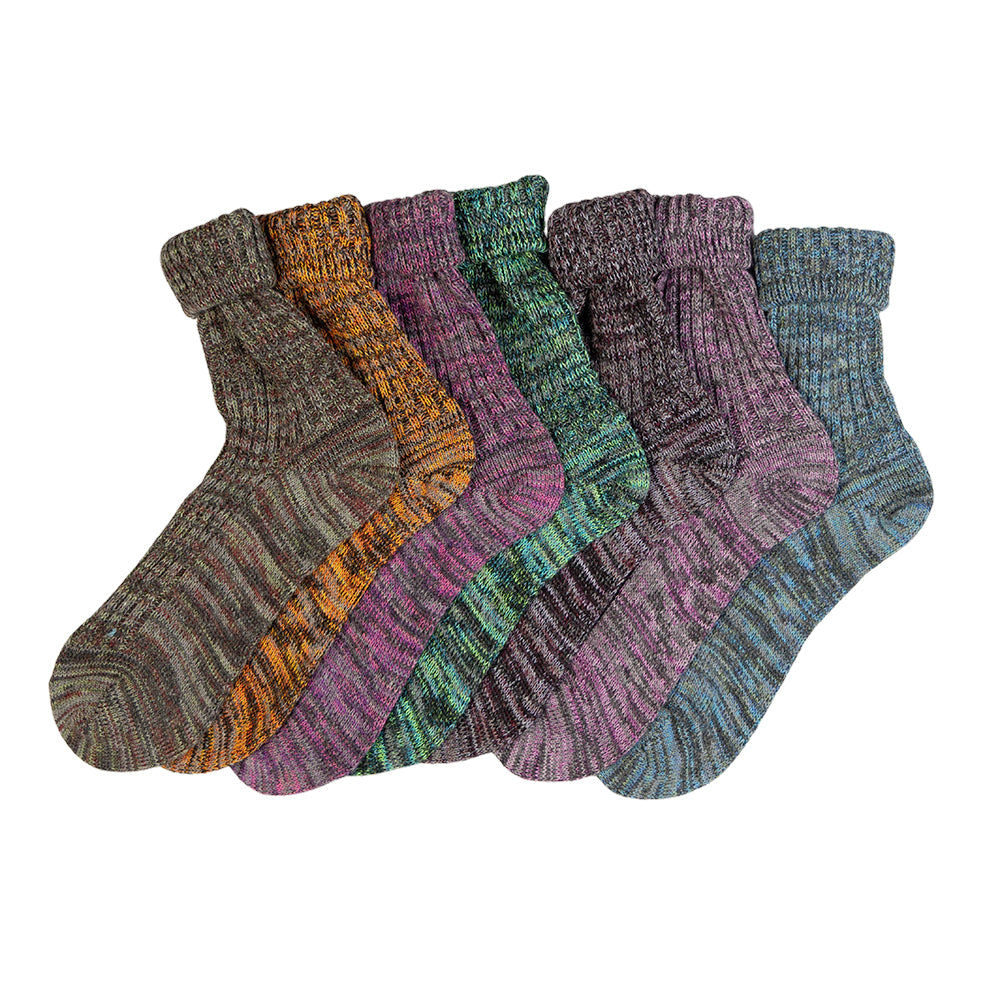 Set of five pairs of patterned socks on a white background