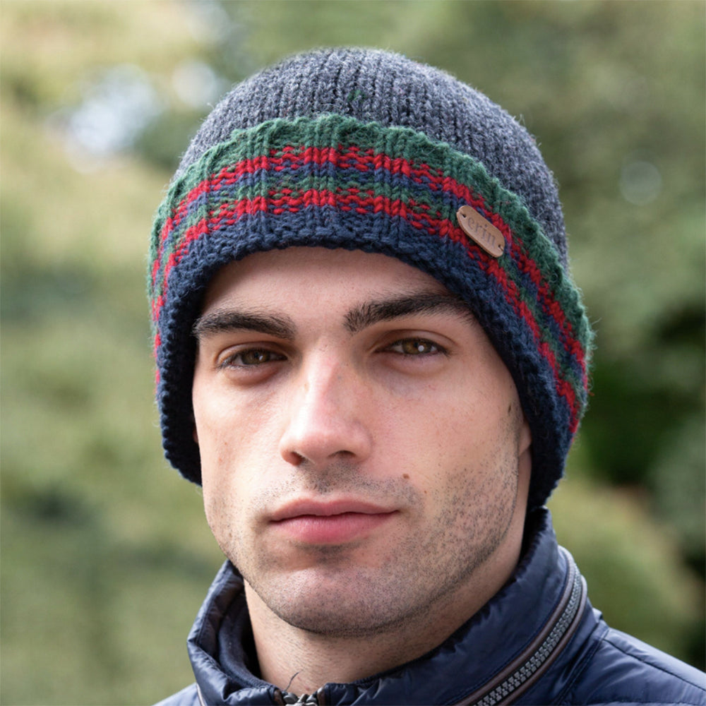 Charcoal green ribbed knit turn-up hat on man