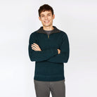 Man wearing Ireland's Eye Pine Green half-zip sweater