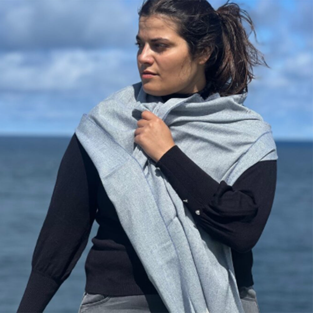 Woman in Merino Cashmere shawl by the sea