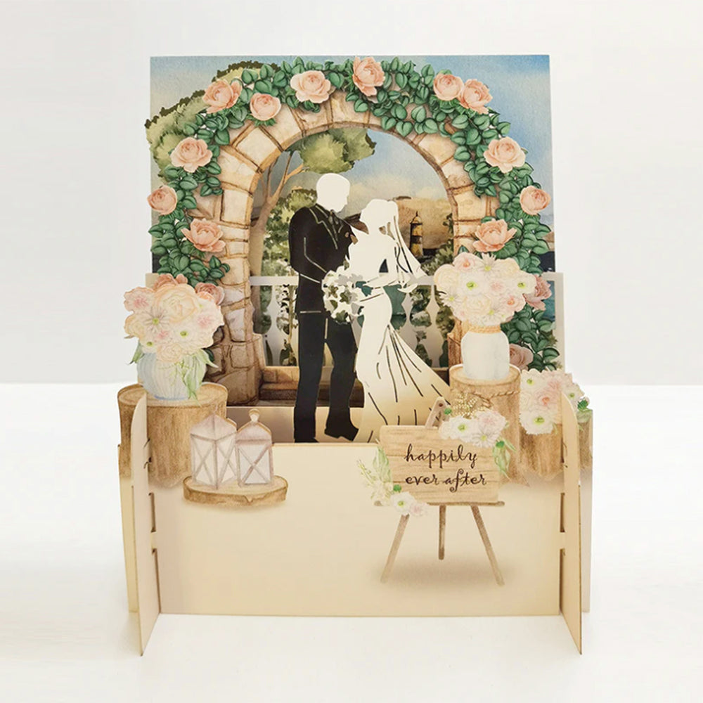 Pop-up wedding card with archway, flowers, and couple.
