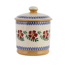 Ceramic jar with floral design and blue decorative patterns on a white background
