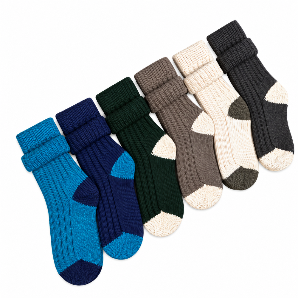 Six pairs of ribbed knit ankle socks arranged diagonally on a white background, shown in blue, navy, dark green, taupe, cream, and charcoal colors.