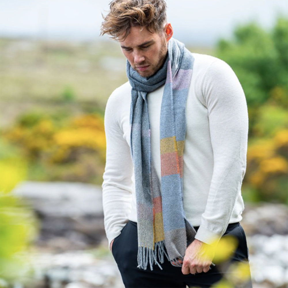 Man wearing idh grey citrus stripe scarf