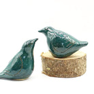 Anita Reynolds teal lovebird sculptures