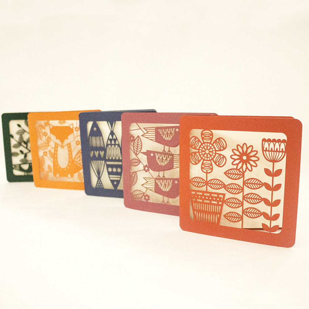 Cutout cards with flower, bird, and leaf designs