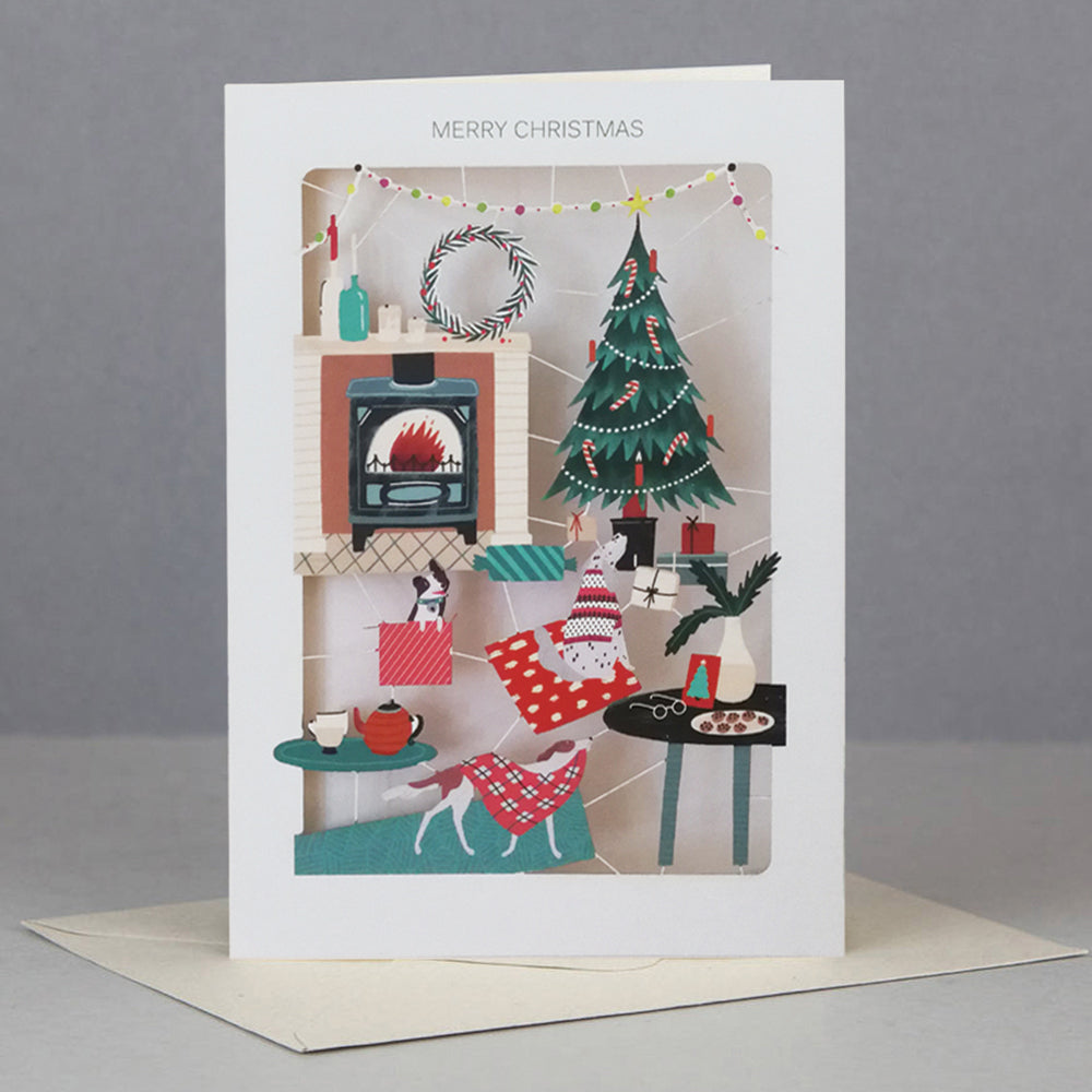 Christmas card with doggies by the fireplace