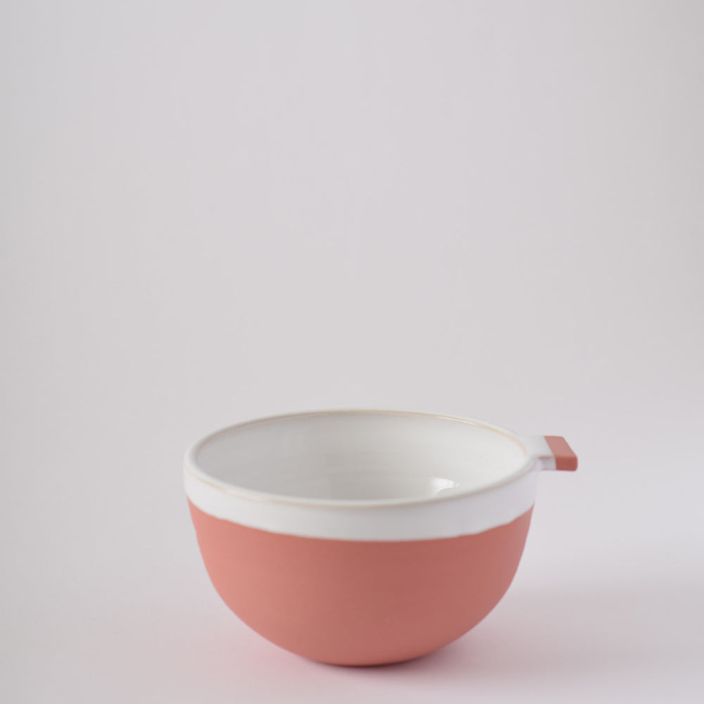 Red ceramic bowl with handle