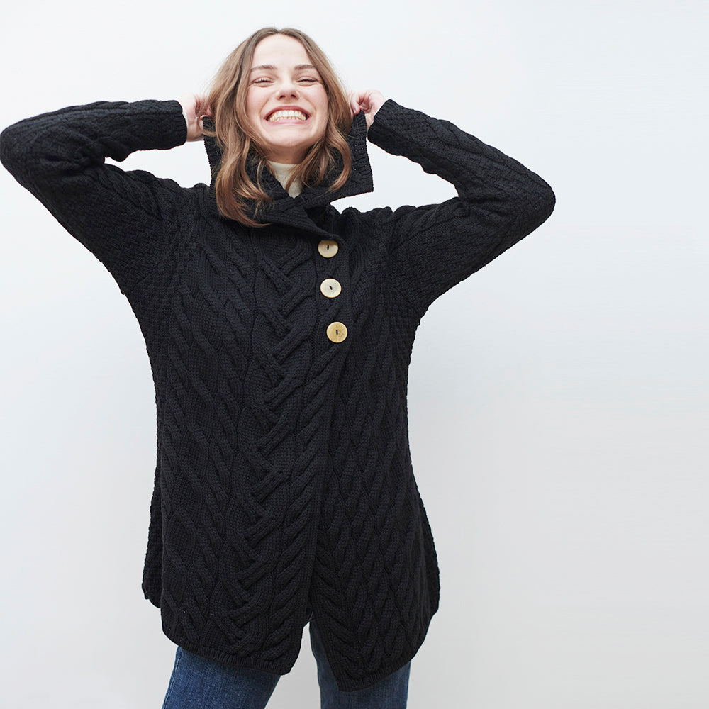 Woman in black 3-button longline cardigan