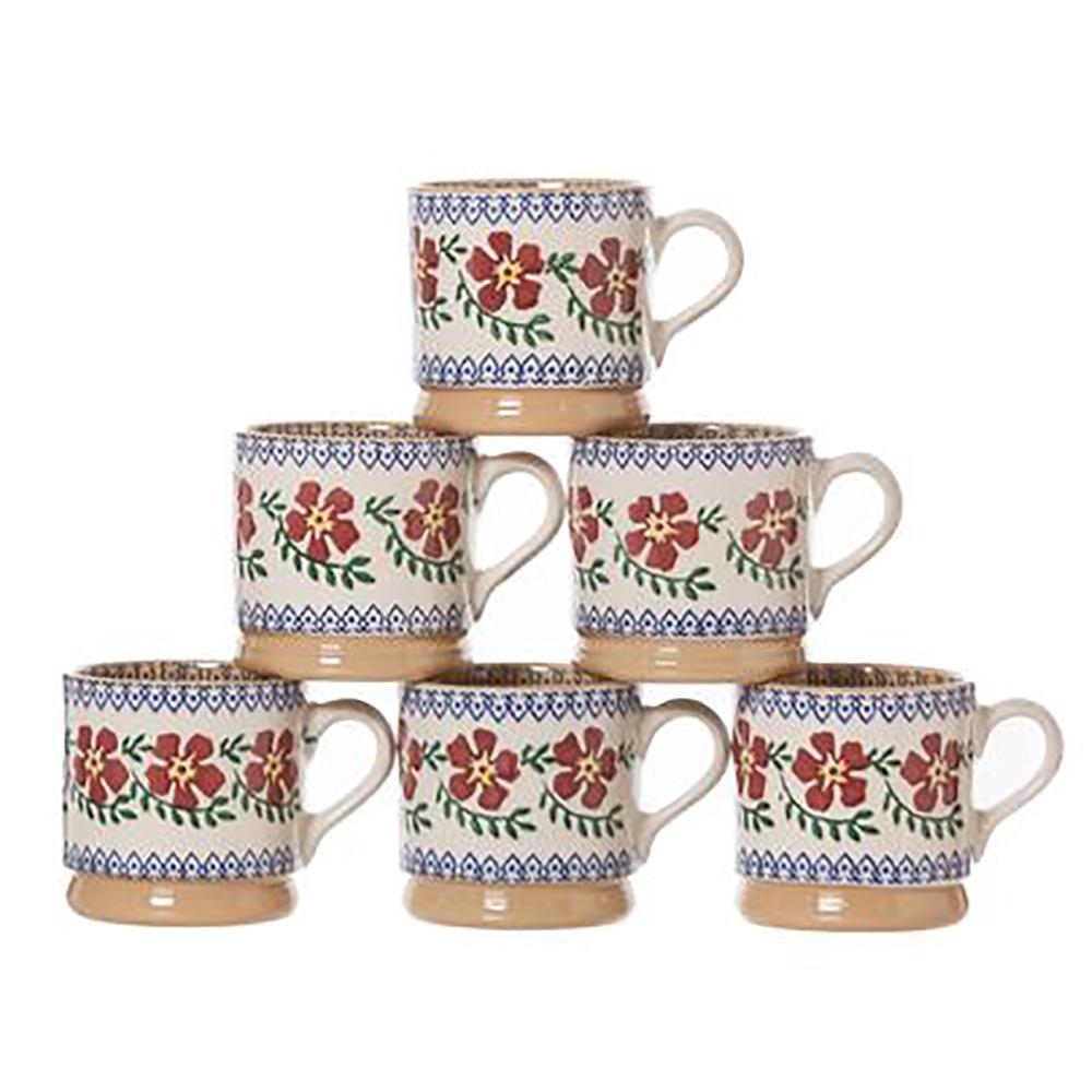 Six small Old Rose spongeware mugs by Nicholas Mosse