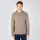 Man in Roundstone sweater on rocky ground