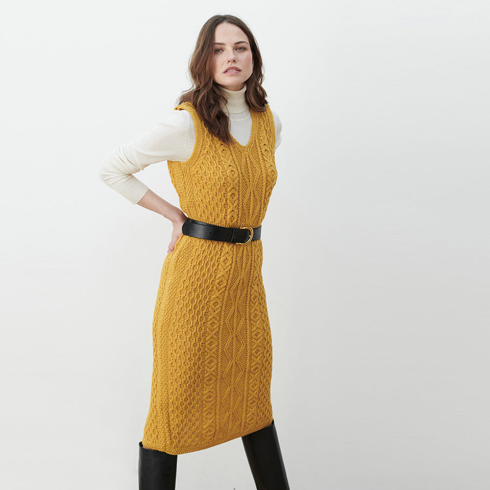 Woman wearing mustard yellow Aran waisted dress