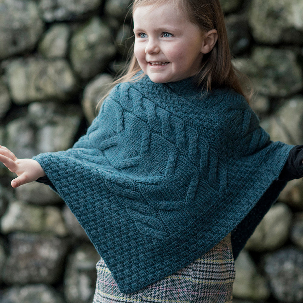 Kids knitted poncho in teal