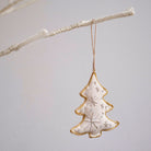 Square Christmas tree ornament hanging on branch
