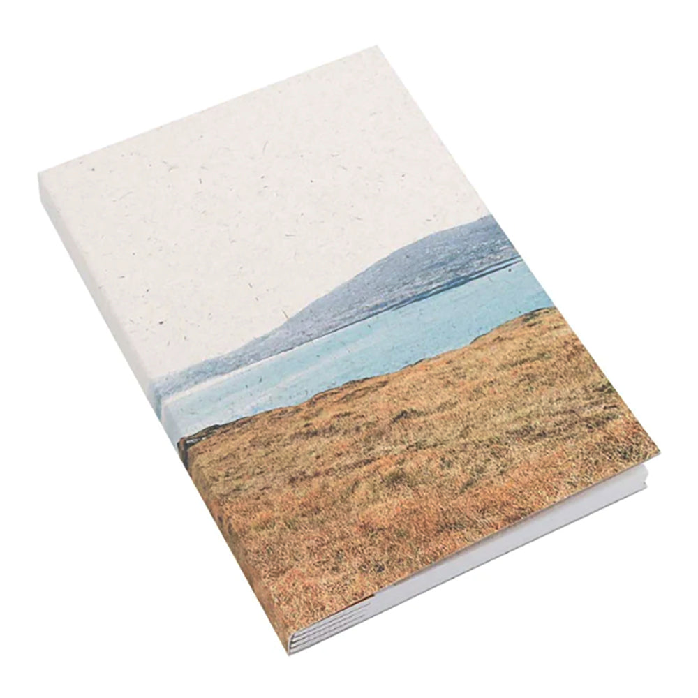 landscape notebook with mountain and sea