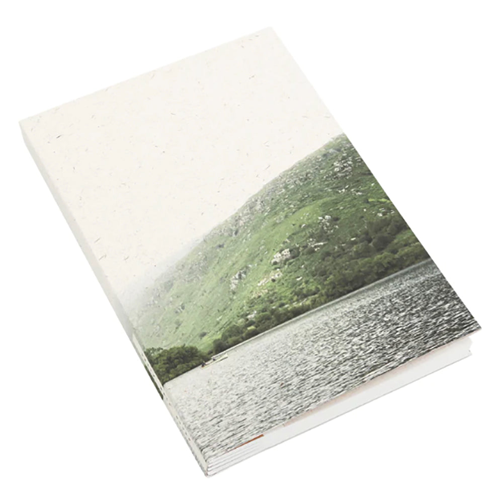 Mountain lake landscape on a square notebook.