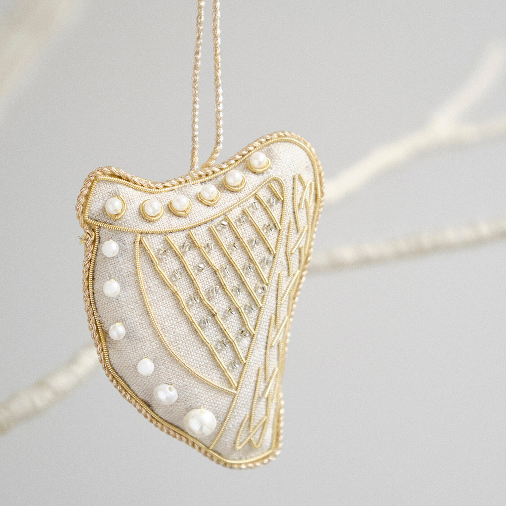 Square harp ornament with gold and pearl details