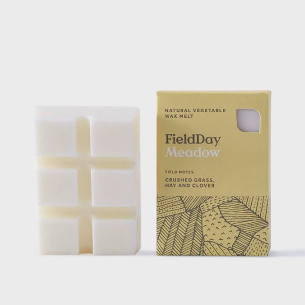FieldDay Meadow wax melt bar with crushed grass, hay, and clover scent.