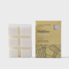 FieldDay Meadow wax melt bar with crushed grass, hay, and clover scent.